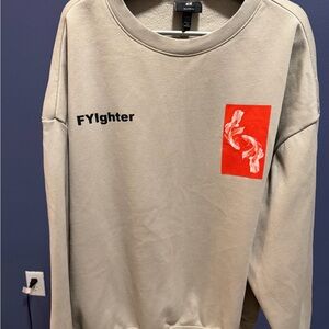 H&M Light Tan Sweater with Bold Red Patch